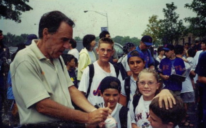 Young Trevor learns the finer points of baseball signing from Grandpa Teddy