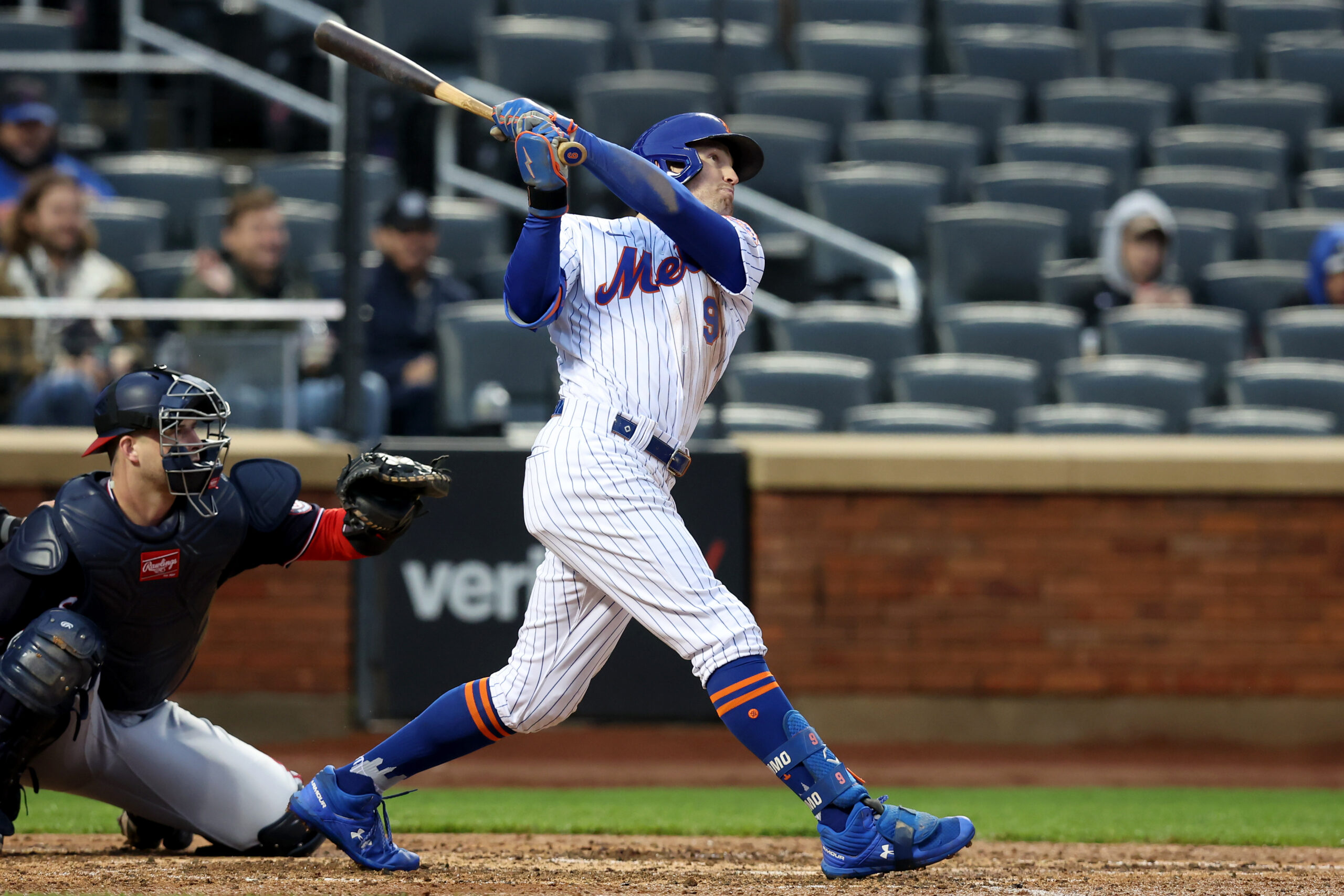 New York Mets center fielder Brandon Nimmo (9) follows through on a solo home run against the Washington Nationals during the fourth inning at Citi Field.