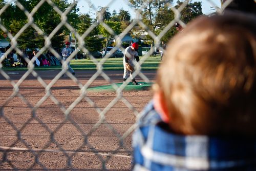 boy fence baseball
